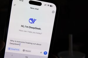 A person holding a cell phone in their hand wechat app interface on smartphone, messaging screen, chinese social media app