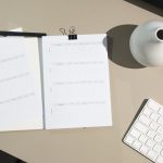 white printer paper on brown wooden table note taking application interface, markdown editor screen, encrypted notes concept