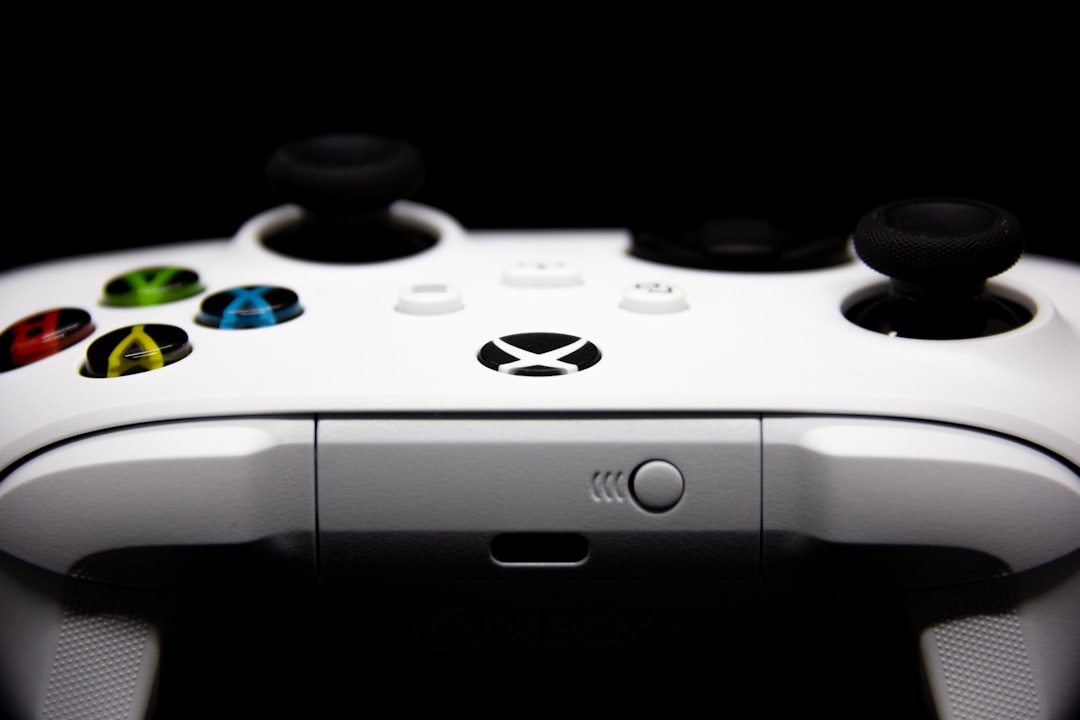 a close up of a video game controller xbox console power cycle, unplugged xbox, xbox power button