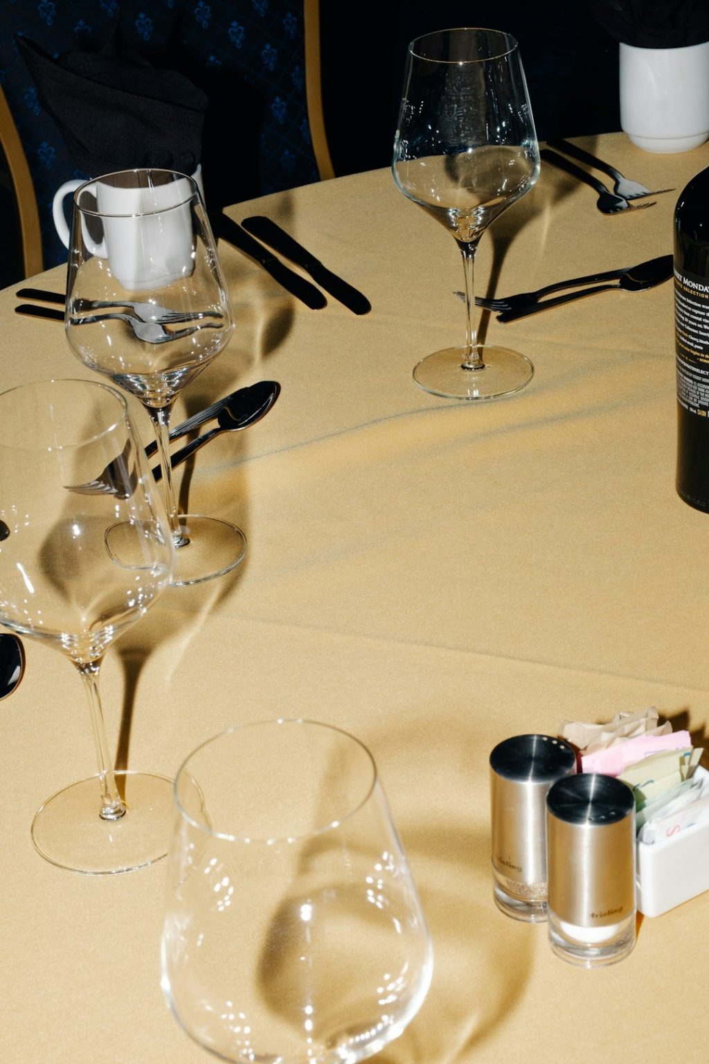 Table setting with wine glasses and cutlery small prosecco bottles, mini sparkling wine, italian prosecco glasses