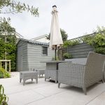 A patio with a table and chairs and an umbrella modern fibreglass plunge pool, small backyard design, timber deck, outdoor seating