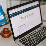 a laptop computer sitting on top of a desk drag and drop editor, website builder dashboard, beginner website design