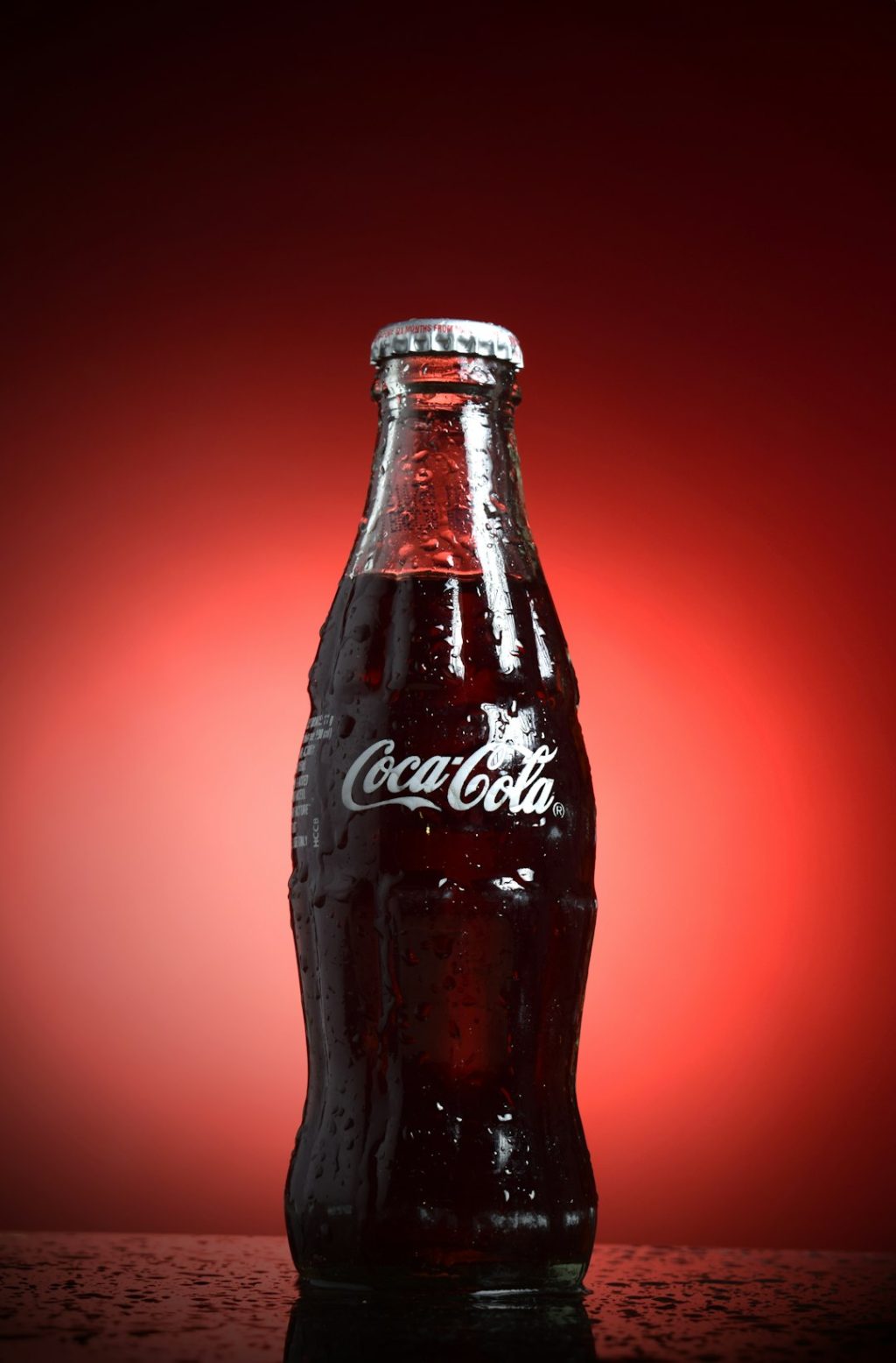 coca cola bottle with red background branded qr code on product packaging, smartphone scanning code, retail marketing display