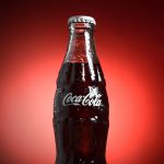 coca cola bottle with red background branded qr code on product packaging, smartphone scanning code, retail marketing display