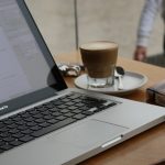 macbook pro on brown wooden table sales team laptop, prospect list interface, email automation workflow