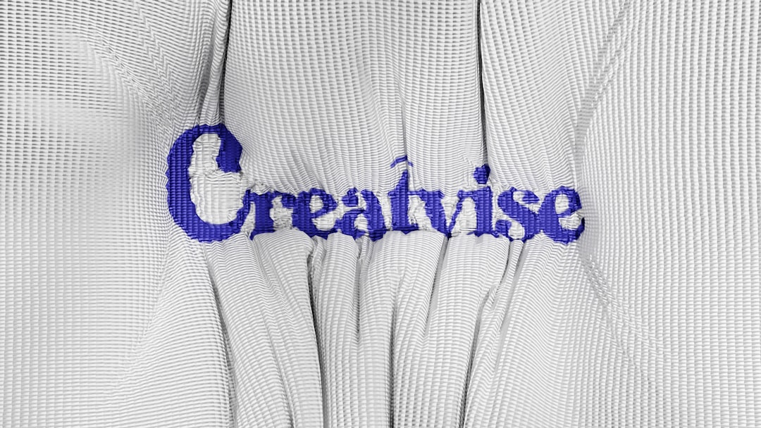 A close up of a white shirt with blue writing on it logo color variations, brand style guide, typography selection