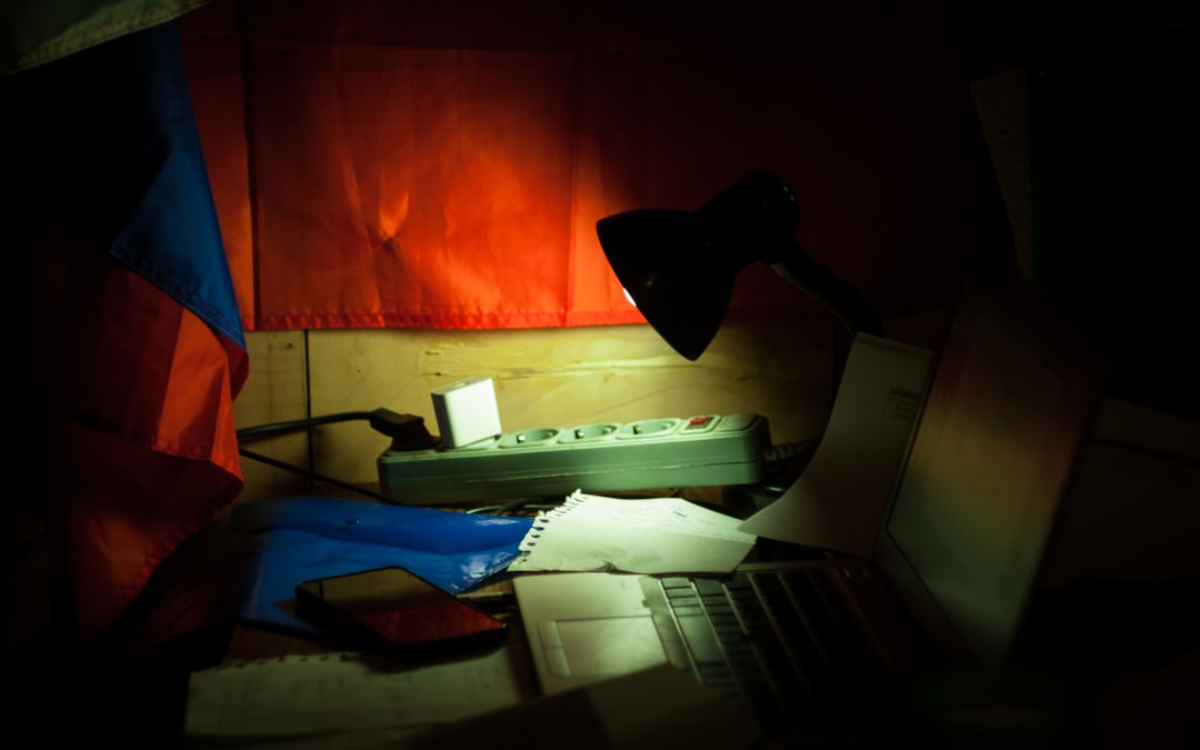 a laptop computer sitting on top of a desk stressed student, messy desk, laptop at night