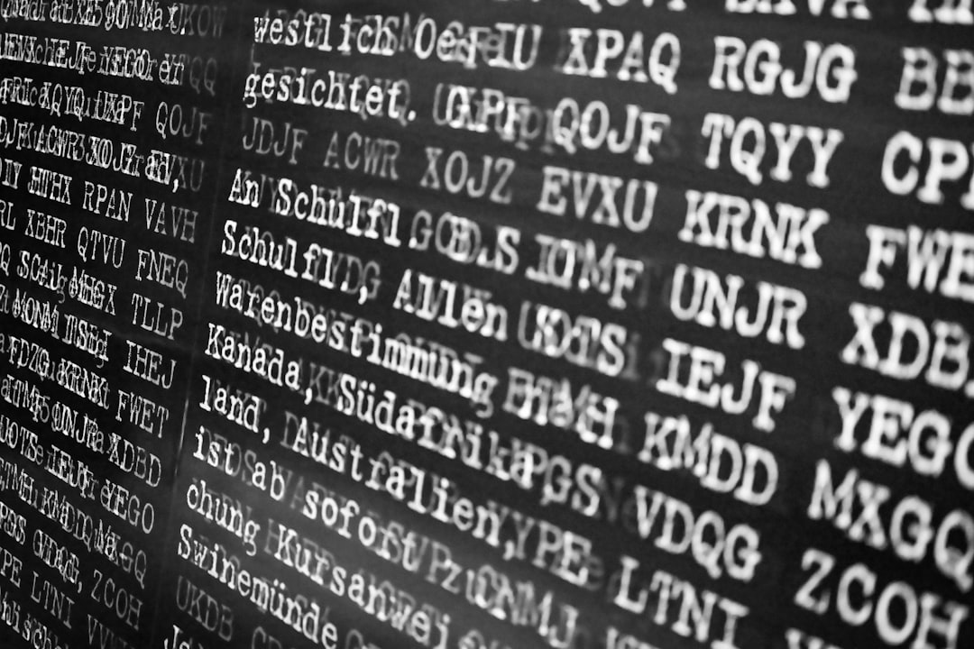 Rows of text on a dark background digital language evolution, abstract typography, online communication concept