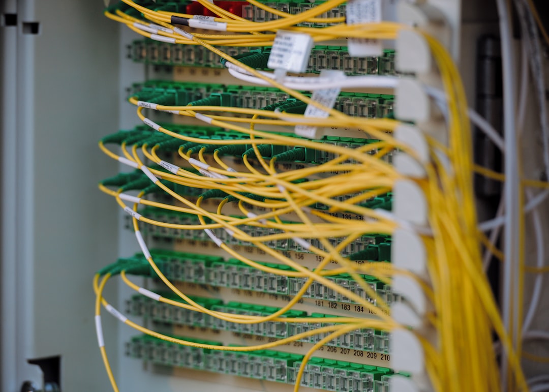 Yellow and green cables are neatly connected. server room, data center, high performance hosting