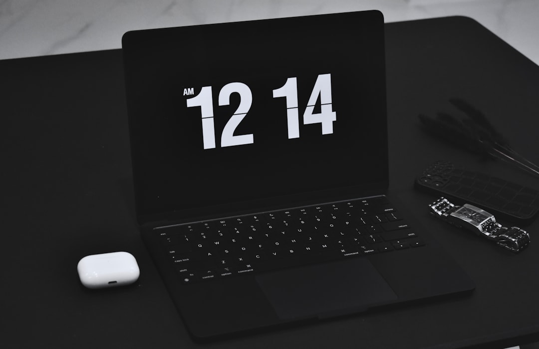 a laptop computer sitting on top of a desk calendar reminder, clock, laptop email notification