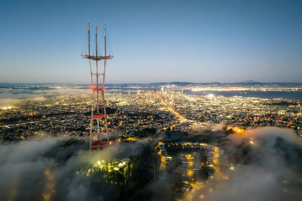 an aerial view of a city at night smartphones, coverage map, city towers