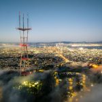 an aerial view of a city at night smartphones, coverage map, city towers