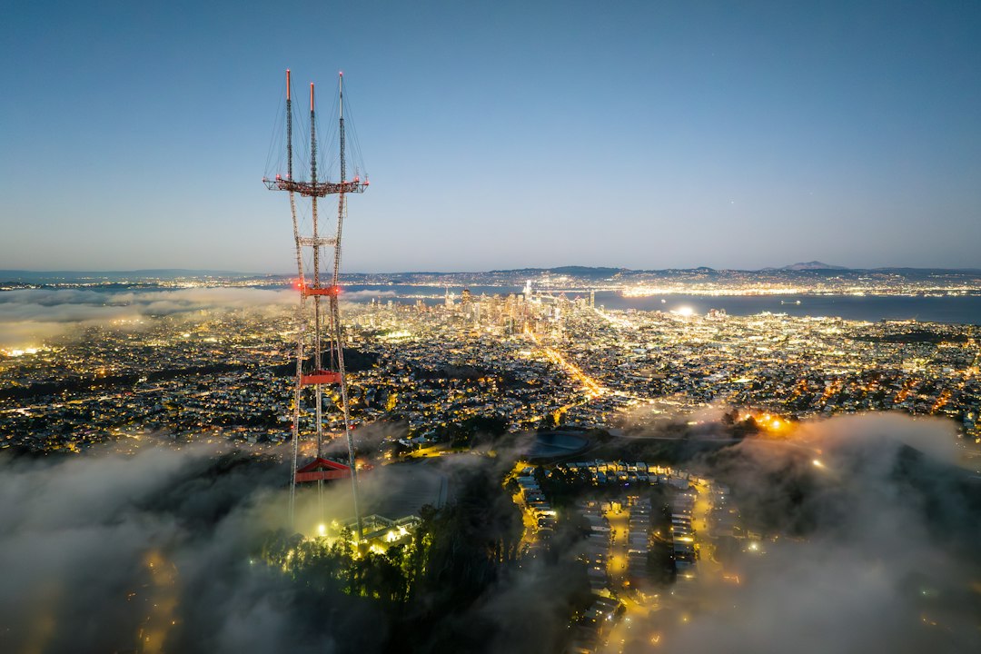an aerial view of a city at night smartphones, coverage map, city towers