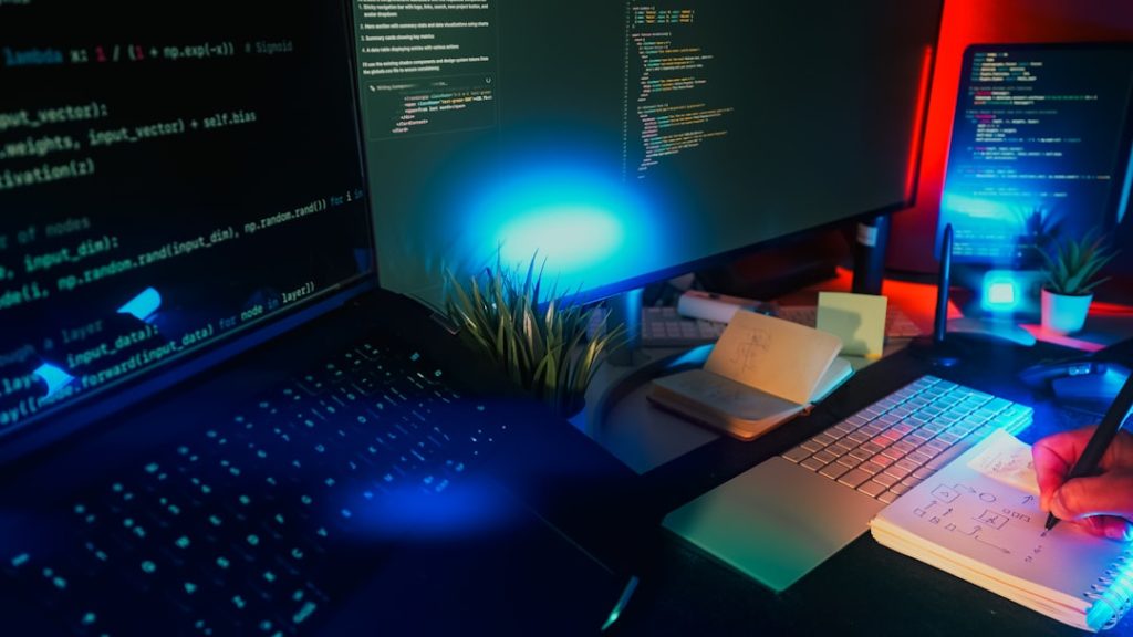 Computer screens displaying code with neon lighting. website builder interface, drag and drop editor, wordpress dashboard, web design workspace