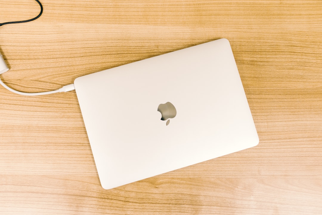MacBook in flat lay photography with white case macbook thunderbolt cable screen sharing