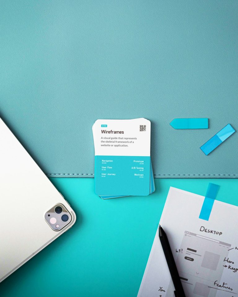 a laptop computer sitting on top of a desk business card template on screen, modern office desk, graphic design interface