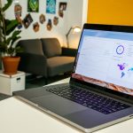 a laptop computer sitting on top of a white table ecommerce dashboard analytics charts laptop screen