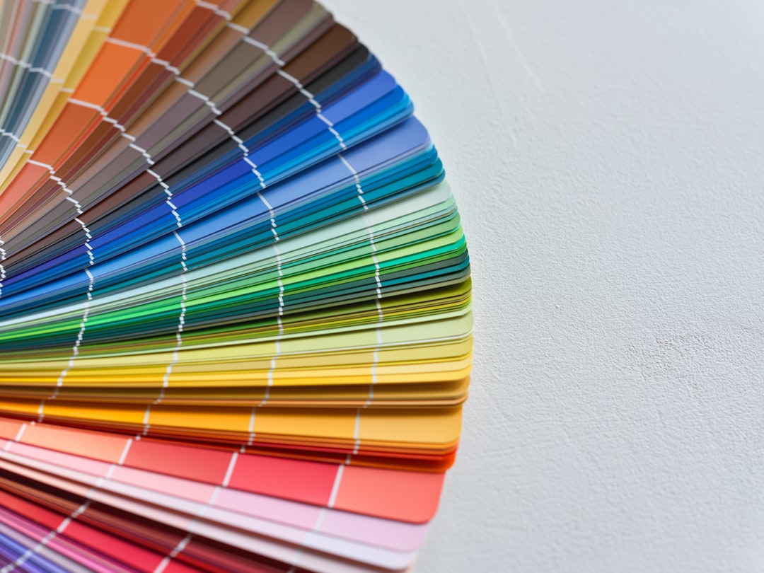 A pan of different colors of paint on a table color palette, web design, style guide
