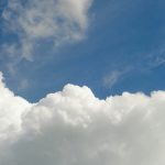 a plane flying through a cloudy blue sky cloud backend dashboard, database interface, api connections, app development screen