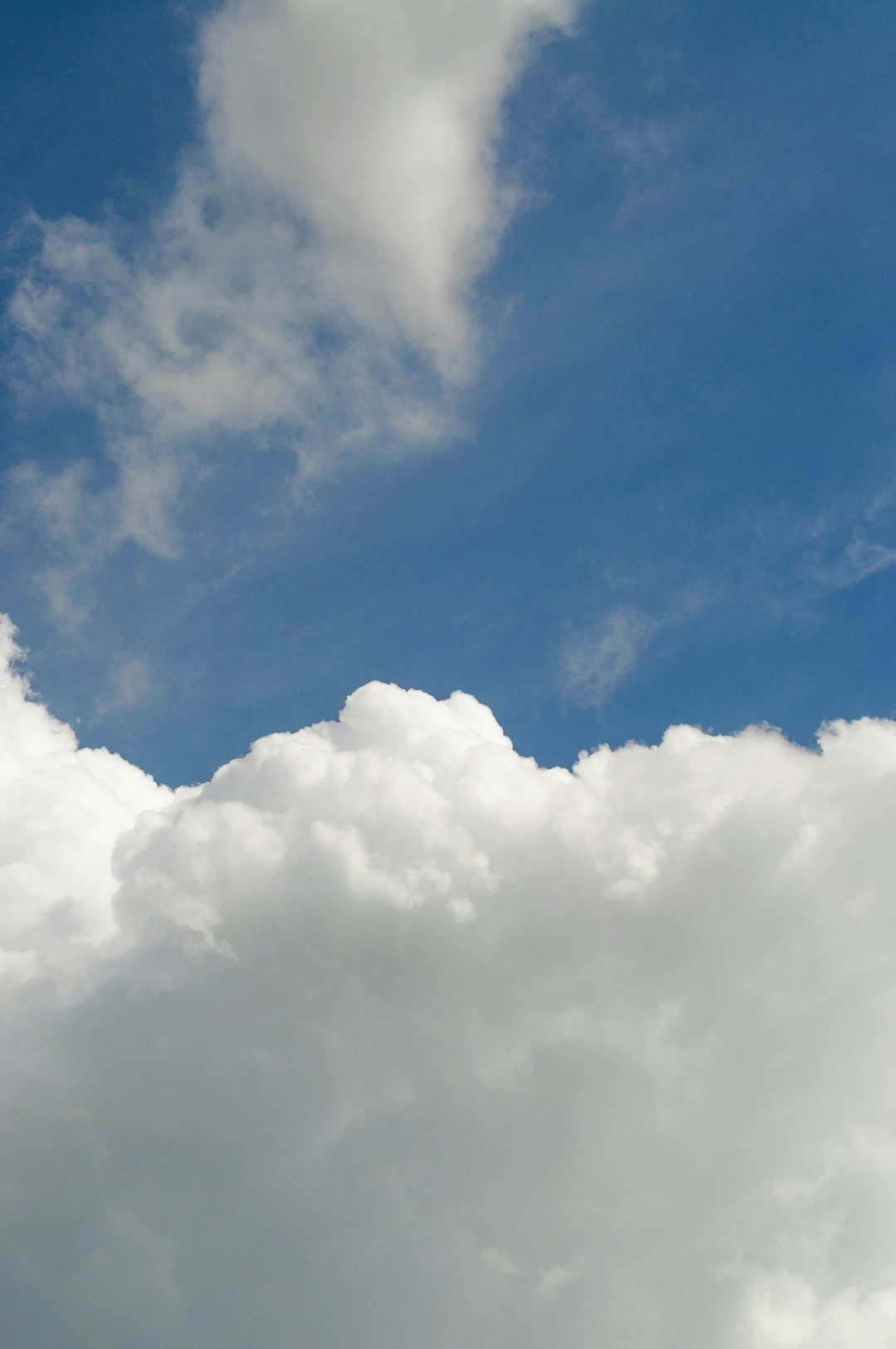 a plane flying through a cloudy blue sky cloud backend dashboard, database interface, api connections, app development screen