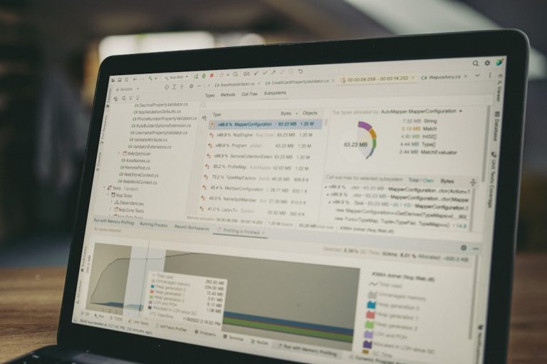 Laptop screen displaying code and data charts. affiliate dashboard analytics screen laptop