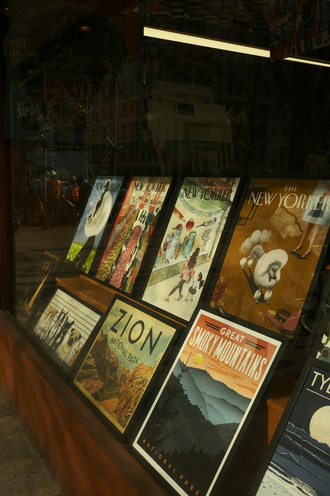 Posters of national parks and the new yorker. movie library interface, film catalog app screen, digital collection dashboard