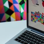 silver laptop computer with assorted logo screengrab ordinateur portable design logo interface simple couleurs vives