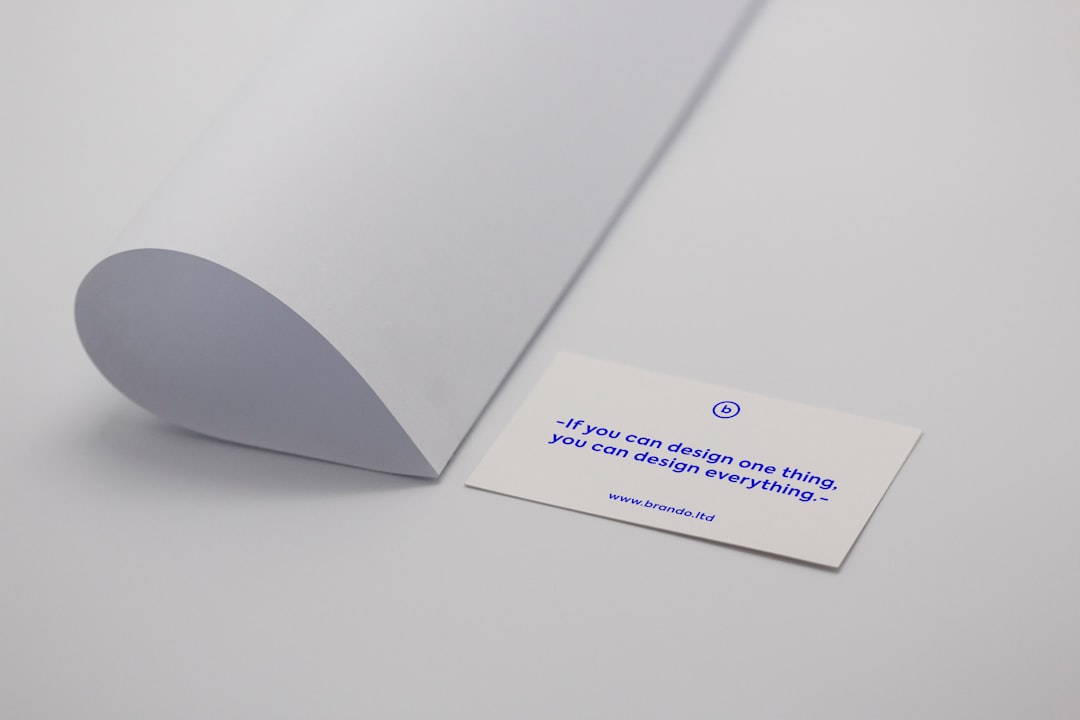 white printer paper minimal business card layout, readable typography, contact details