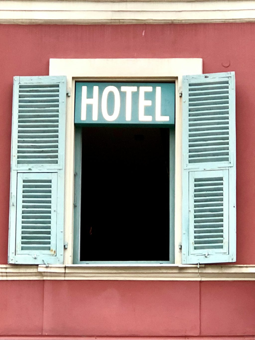 white wooden window frame on red wall boutique hotel website booking form, modern reservation interface, hospitality website design