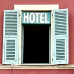 white wooden window frame on red wall boutique hotel website booking form, modern reservation interface, hospitality website design