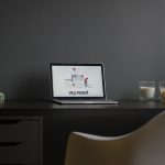 macbook air on black wooden desk modern workspace laptop logo design screen minimal desk