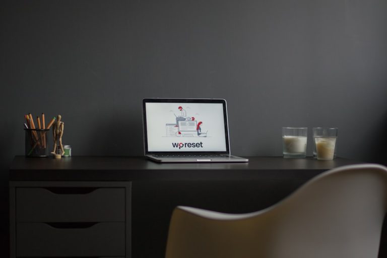 macbook air on black wooden desk modern workspace laptop logo design screen minimal desk
