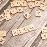 scrabble tiles spelling out words on a wooden surface content outreach email, blogger collaboration, guest article publishing
