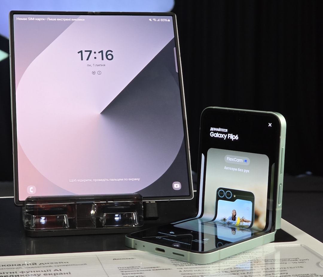 A cell phone and a laptop on a table samsung tv settings menu, software update screen, smart tv interface