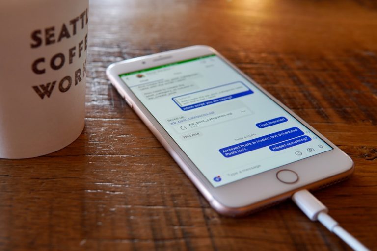 a cell phone on a table customer support chat, mobile app interface, user engagement analytics