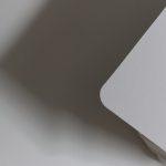 a close-up of a shadow wifi router, unstable connection icon, buffering screen