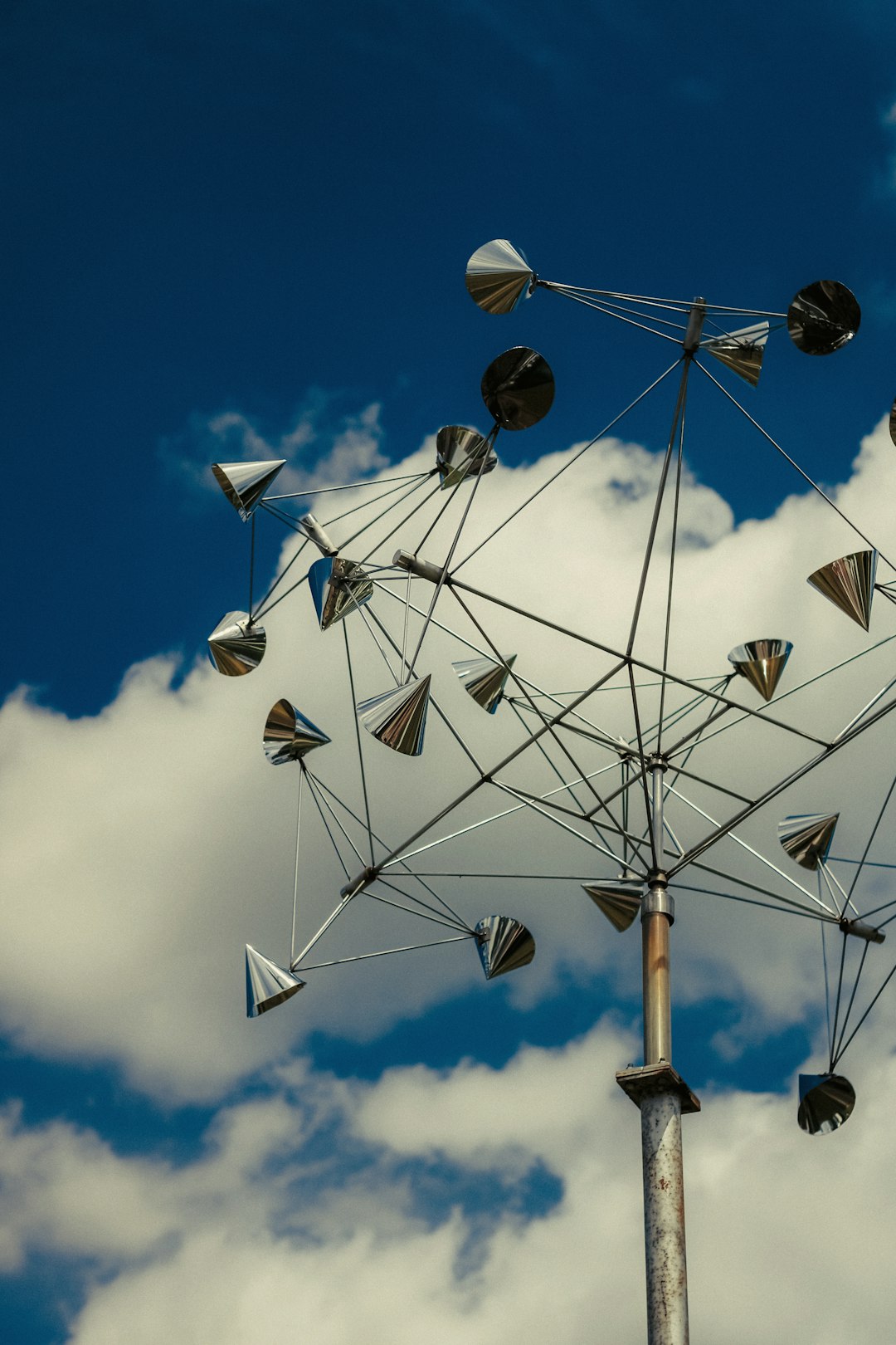 A ferris wheel in the middle of a cloudy sky cloud load balancing, network traffic distribution, microservices communication, server nodes