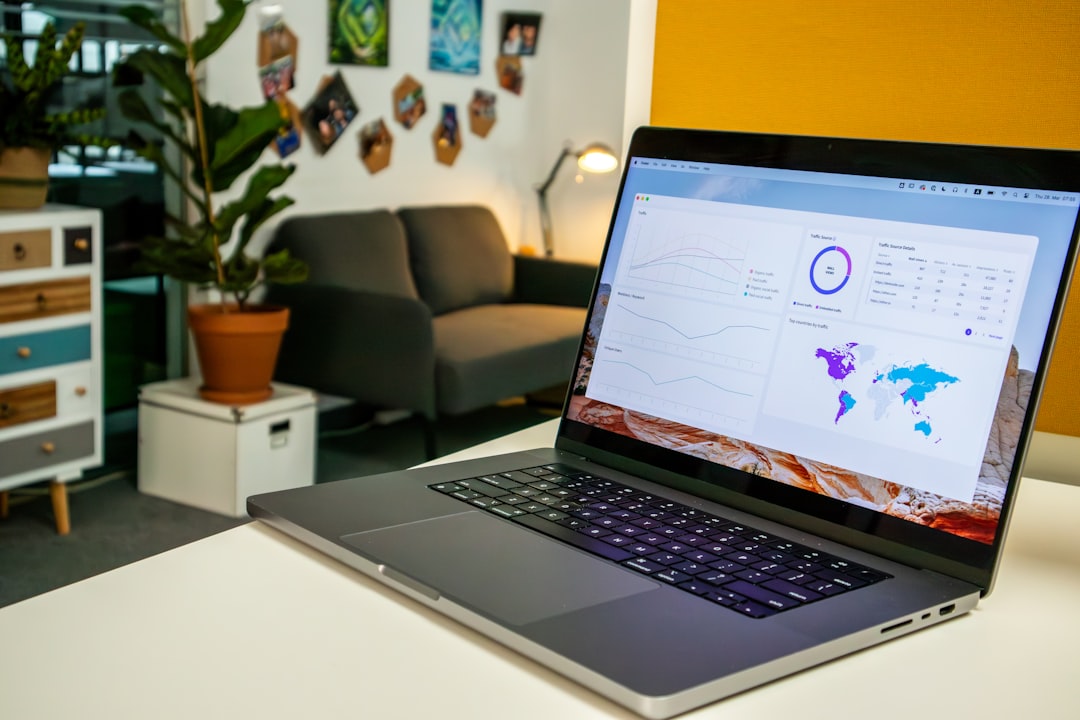 a laptop computer sitting on top of a white table ecommerce dashboard analytics charts laptop screen