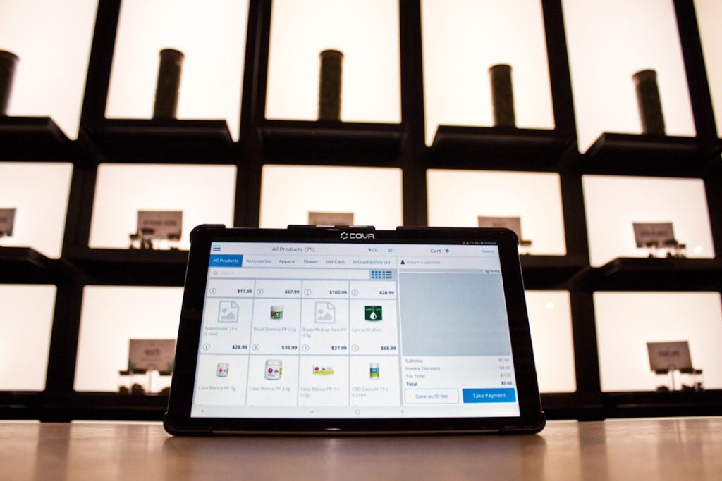 a laptop computer sitting on top of a wooden table cloud storage dashboard, file sharing screen, laptop and smartphone syncing
