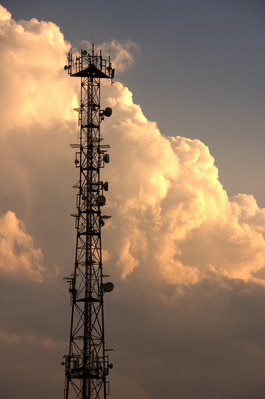 A tall tower with a lot of antennas on top of it cloud load balancing, network traffic distribution, microservices communication, server nodes
