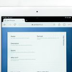 a white rectangular device with a screen cloud dashboard interface, file sharing screen, modern web app