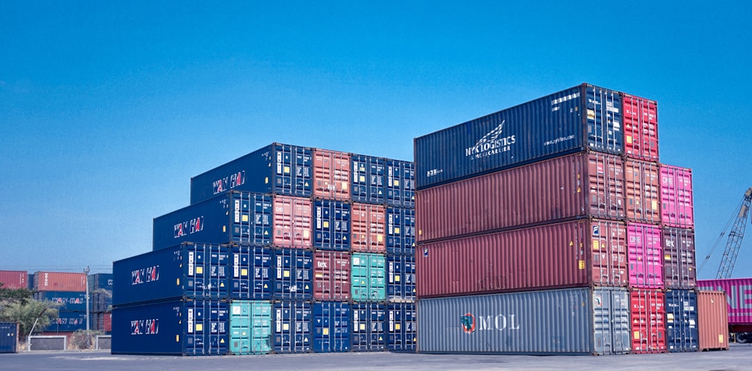 architectural photography of cargo containers stack global ecommerce map shipping routes warehouse logistics