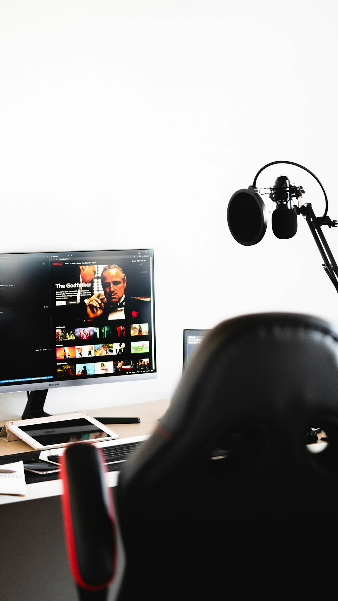 black flat screen computer monitor netflix app reinstall screen, samsung smart hub, person using tv remote