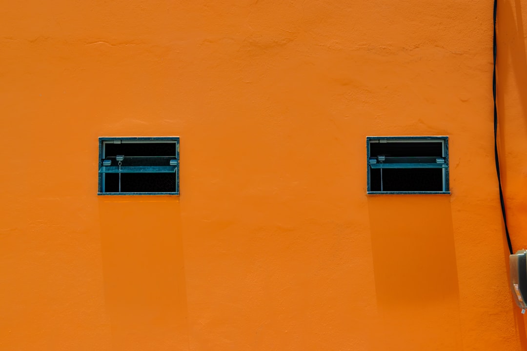 two windows on an orange wall with a parking meter postgres redis dashboard, docker containers list, database connection diagram