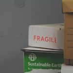 white and red Fragile labeled box professional packers wrapping furniture, bubble wrap packing, fragile items boxed