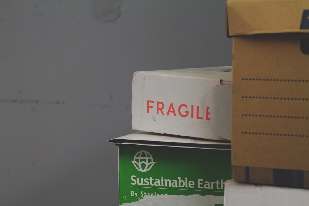 white and red Fragile labeled box professional packers wrapping furniture, bubble wrap packing, fragile items boxed