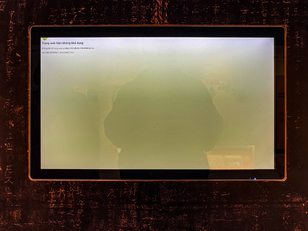 A computer screen shows a hazy green display. minecraft error log screen, code text monitor, gamer troubleshooting setup