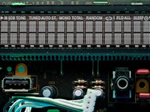 A digital display shows radio station and settings. gpu control panel, overclock settings, computer motherboard bios