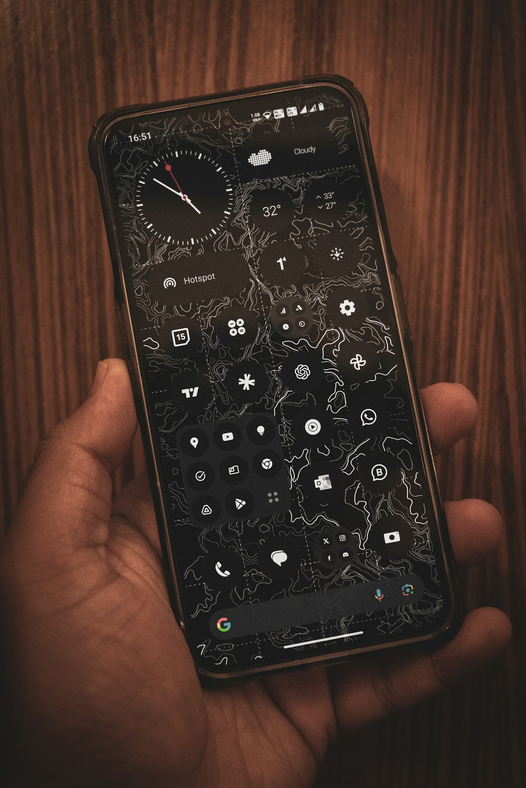 a person holding a cell phone in their hand smartphone settings screen, clear cache option, mobile app storage menu