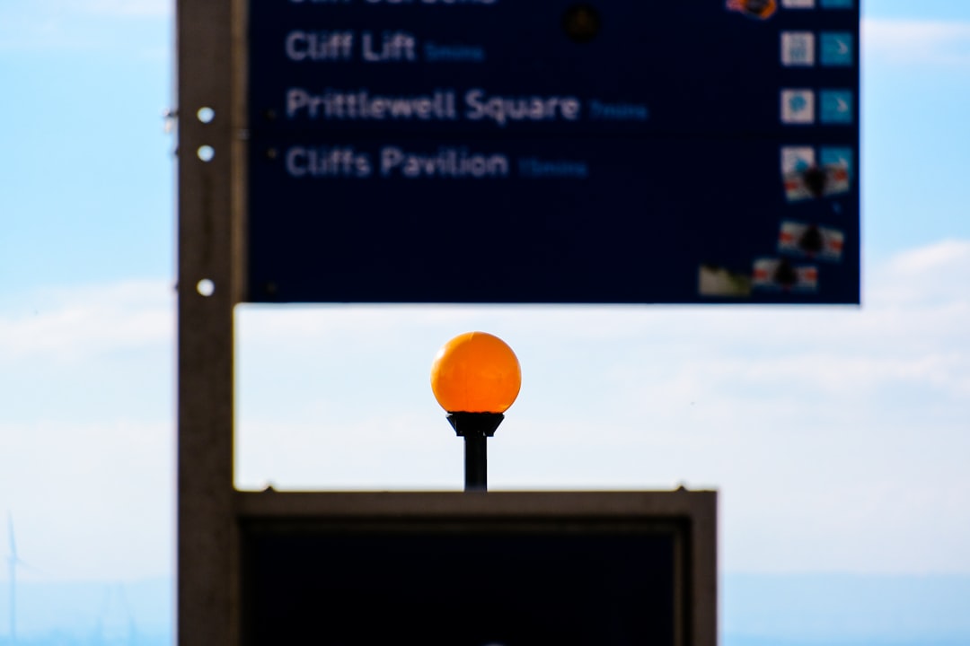 A street sign with an orange ball on top of it linux firewall settings screen, terminal ufw command, server security dashboard
